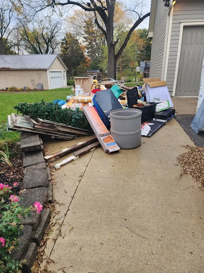 Dumpster being loaded with debris for Demolition Dumpster Rental in Menallen